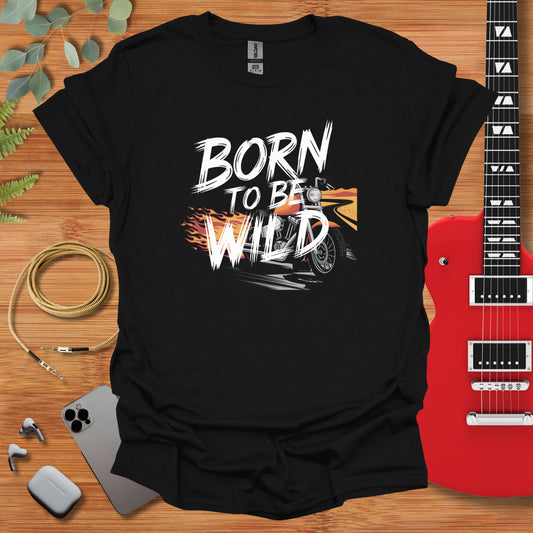 a t - shirt that says born to be wild next to a guitar