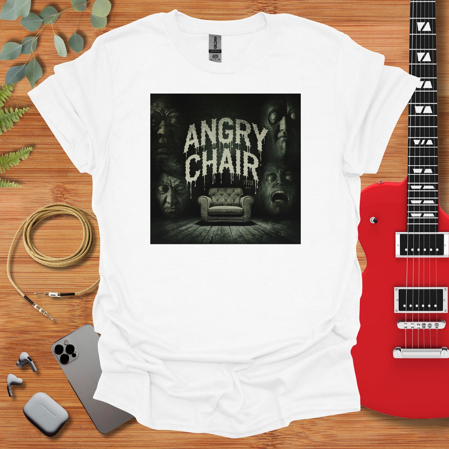 a t - shirt with an image of a couch and a guitar