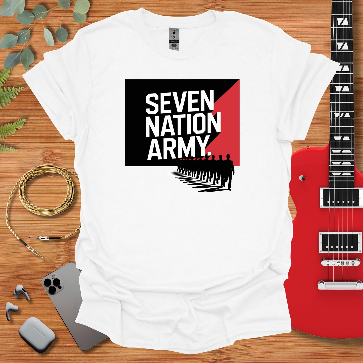 a white t - shirt with the words seven nation army on it