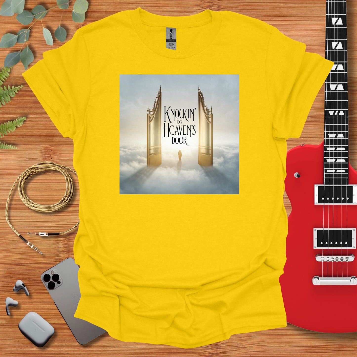 a yellow t - shirt with a picture of a tower on it