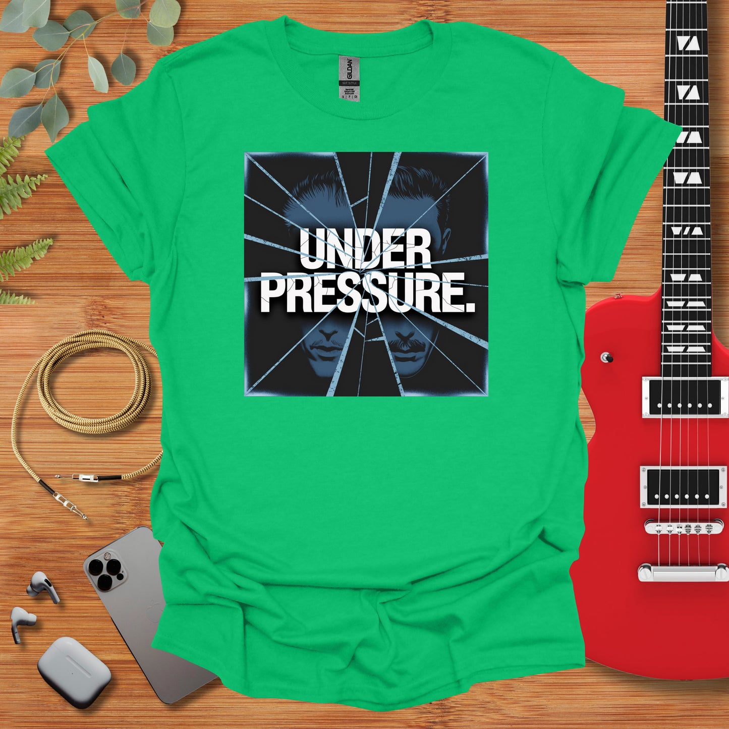 a green shirt with the words under pressure on it