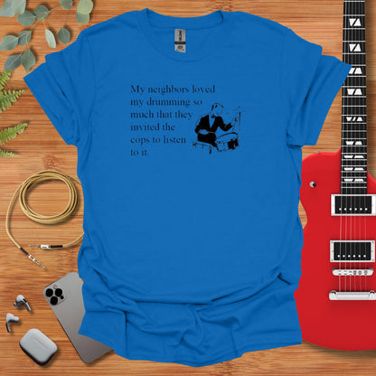 a blue t - shirt with a picture of a man playing a guitar