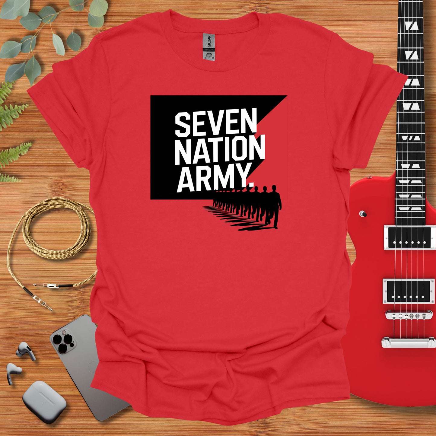 a red shirt with the words seven nation army on it