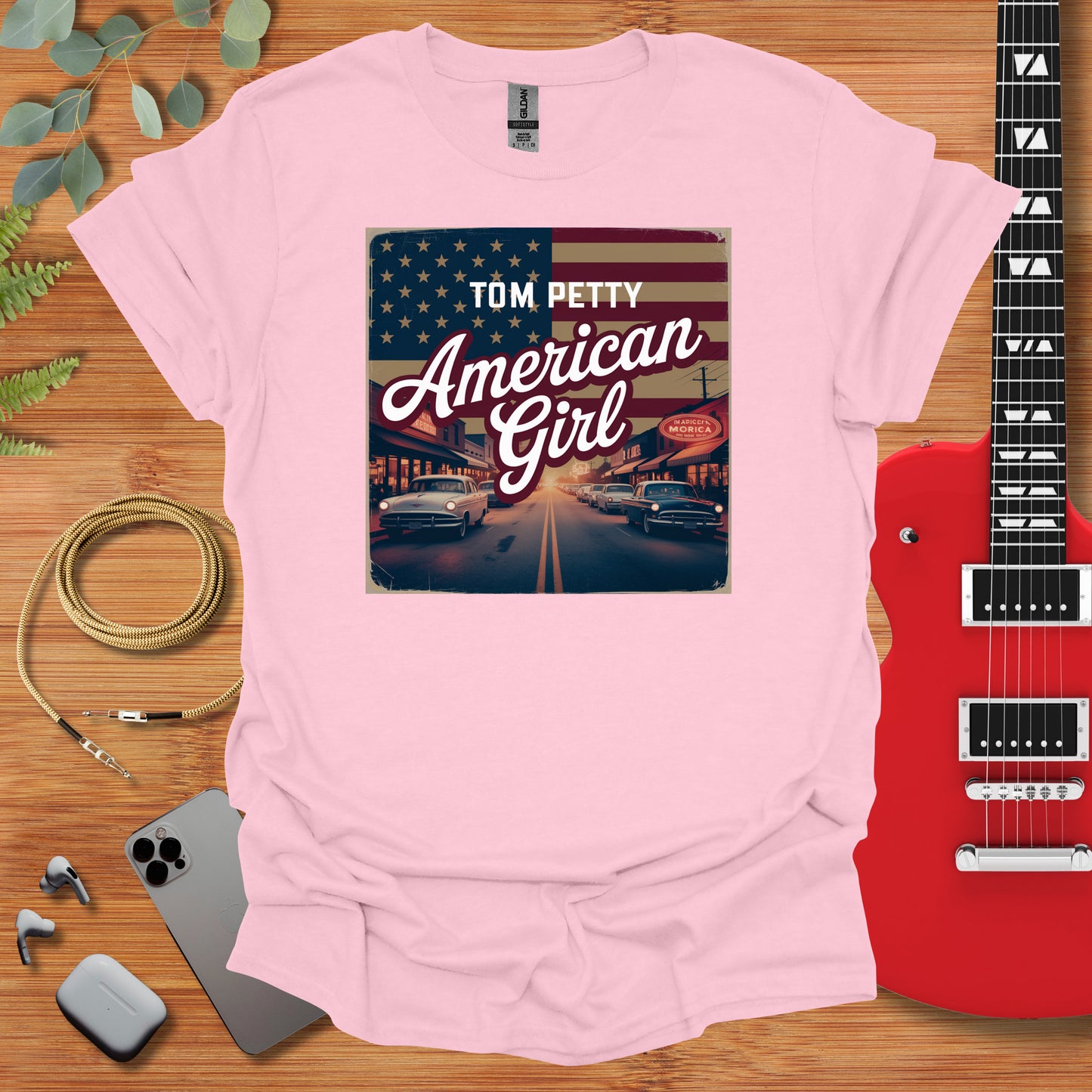 a pink t - shirt with the words tom petty american girl on it