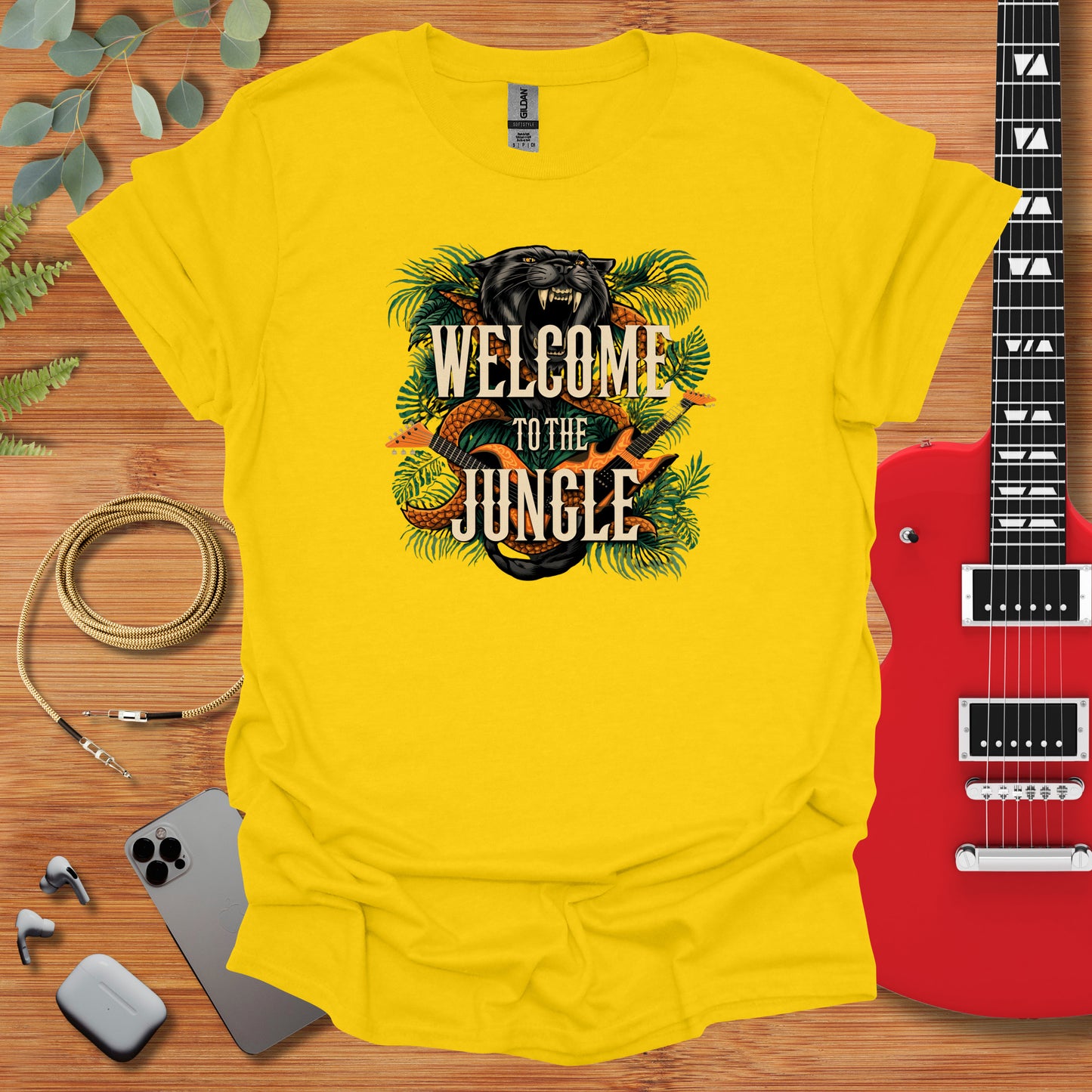 a yellow t - shirt with the words welcome to the jungle on it