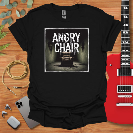 a black shirt with an image of a chair and a guitar