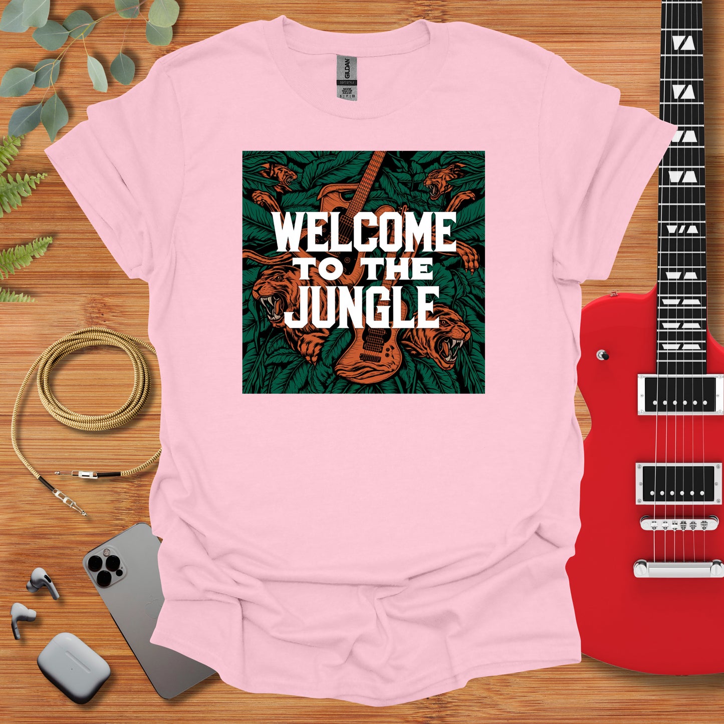 a pink t - shirt with the words welcome to the jungle on it