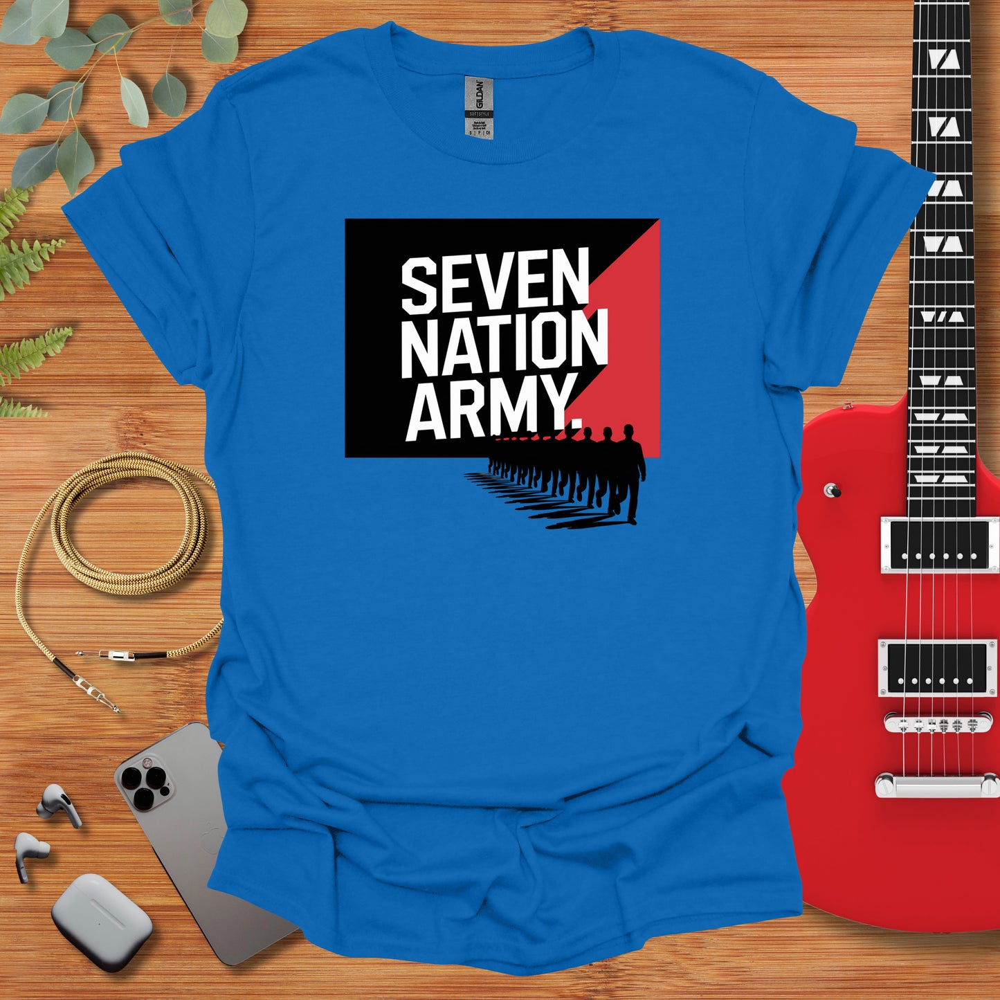 a blue t - shirt with the words seven nation army on it