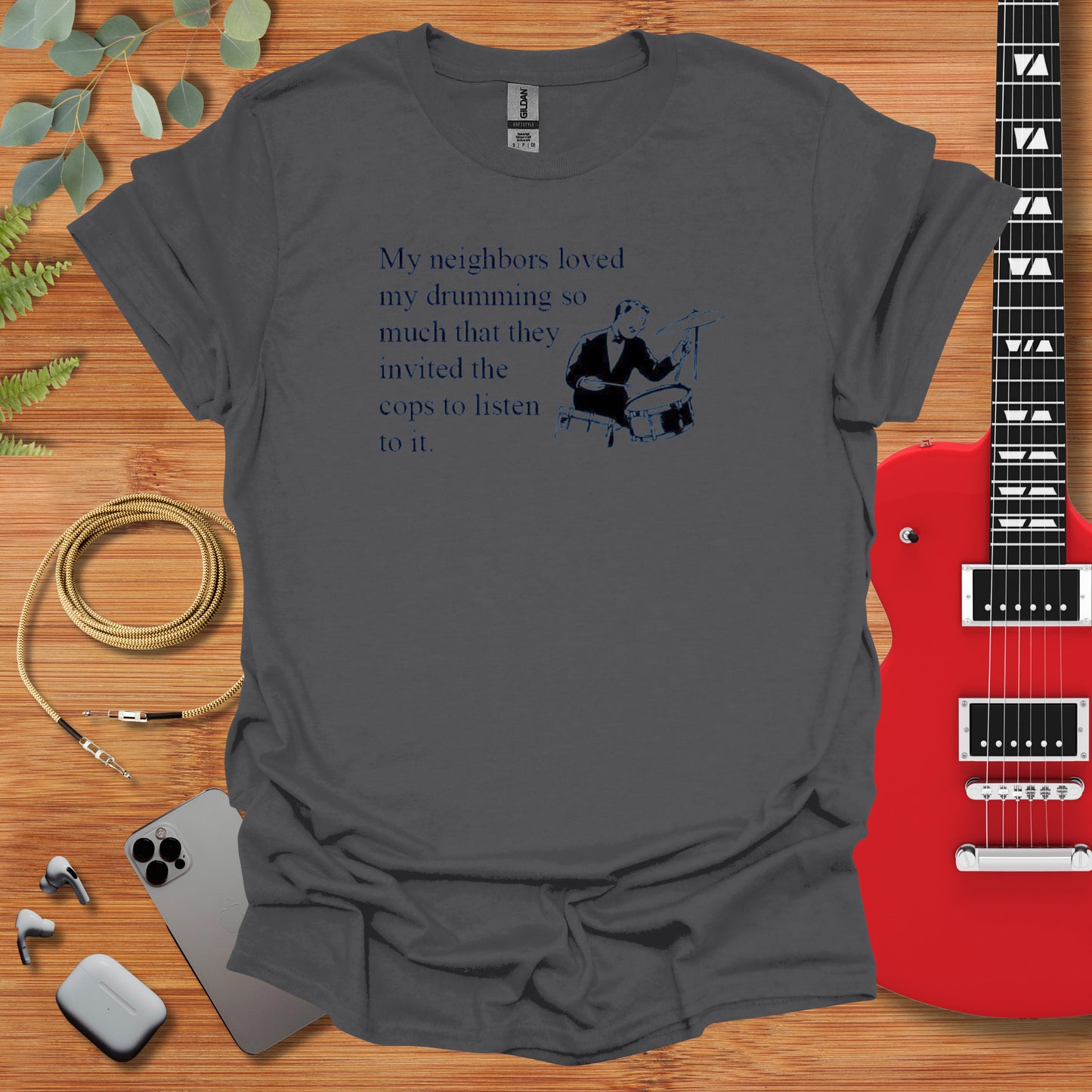 a guitar and a t - shirt with a poem on it