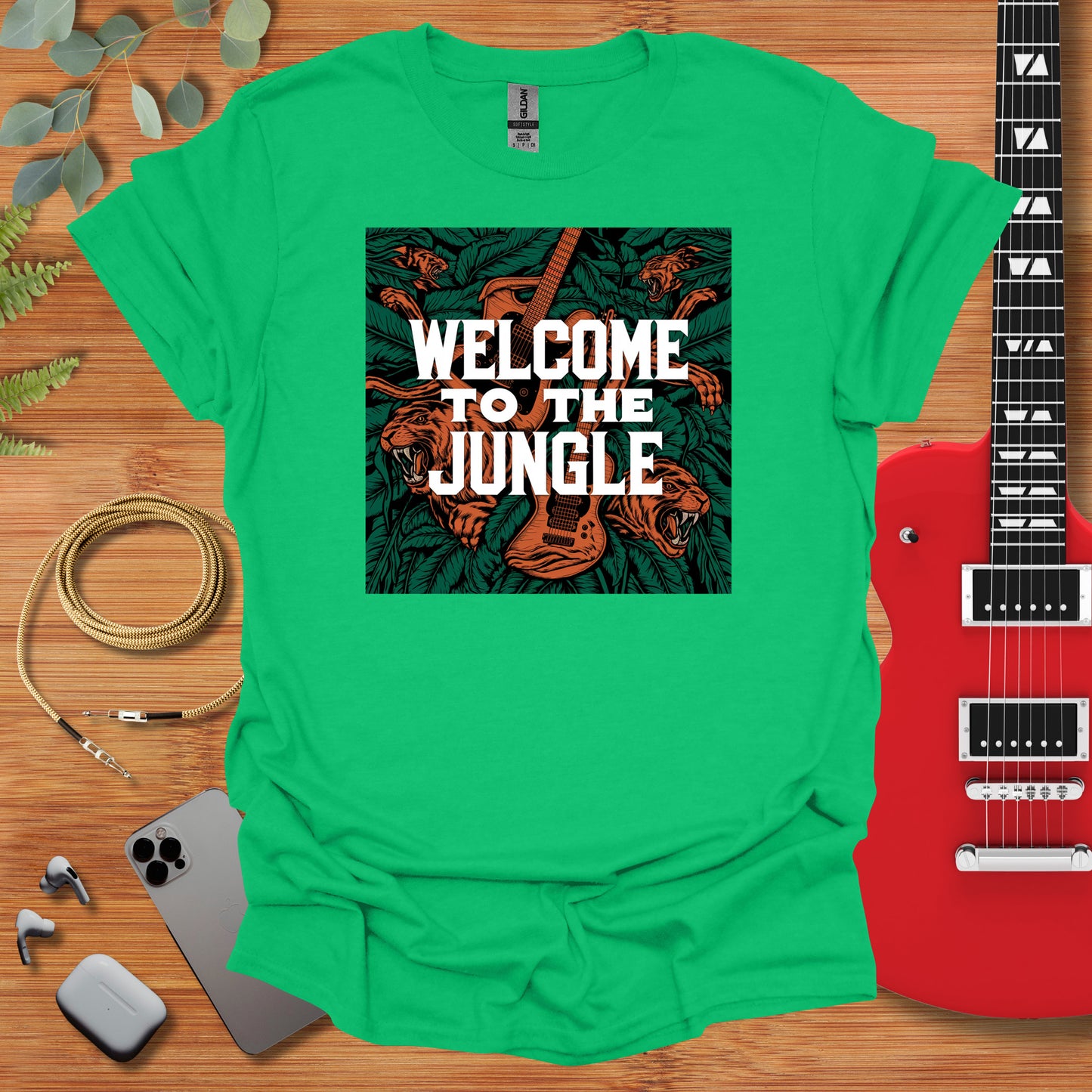 a green shirt with the words welcome to the jungle on it