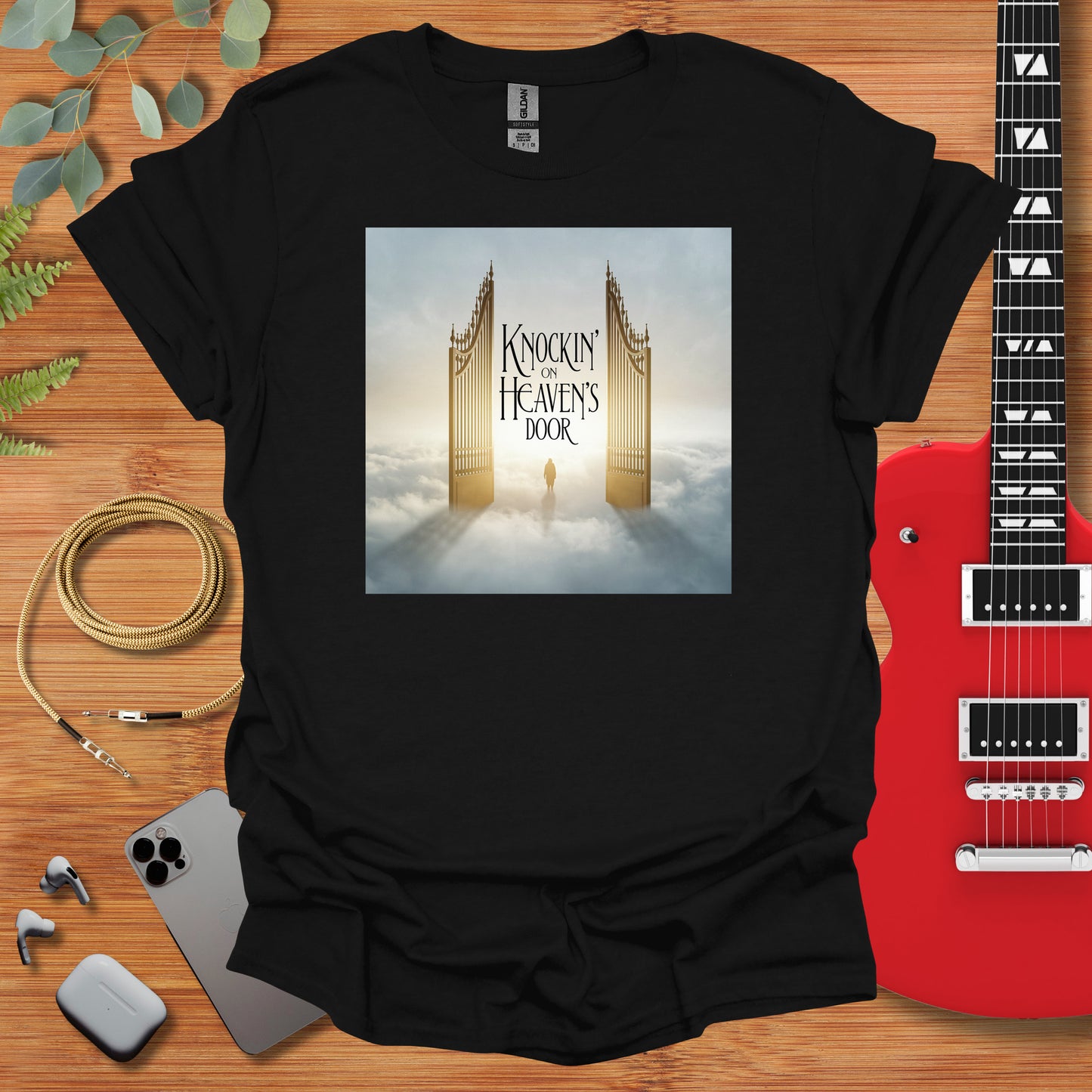 a black t - shirt with a picture of a golden gate on it