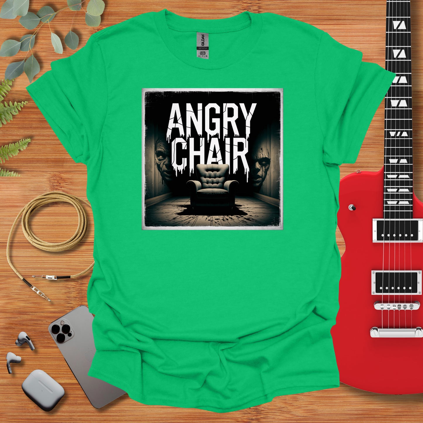 a green shirt with an image of an angry chair on it