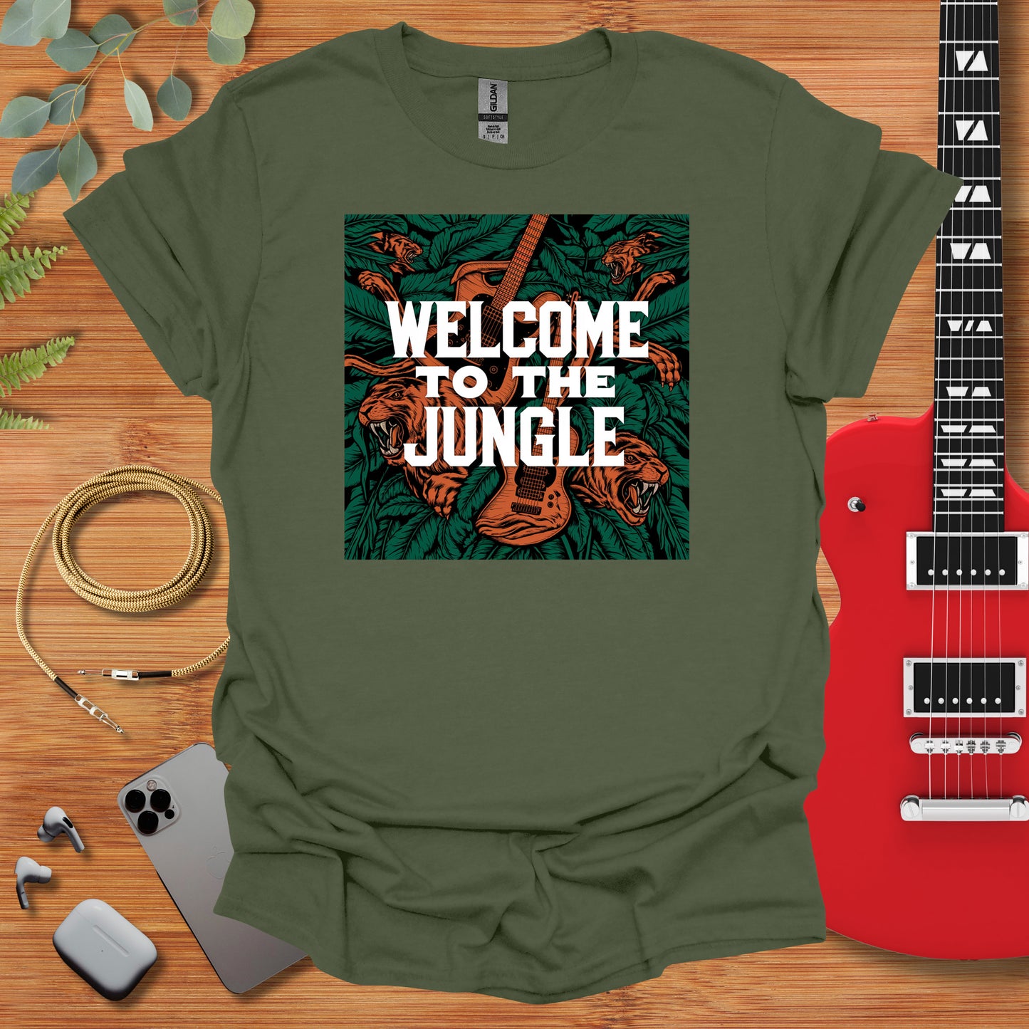 a green t - shirt with the words welcome to the jungle on it