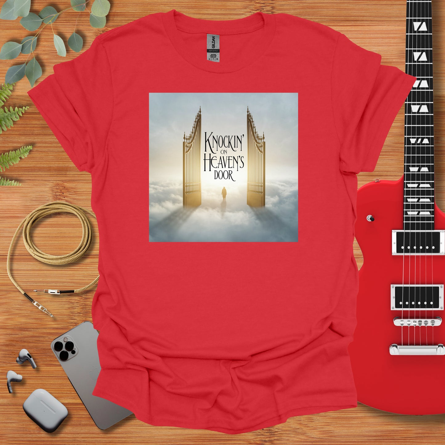 a red t - shirt with a picture of a golden gate on it