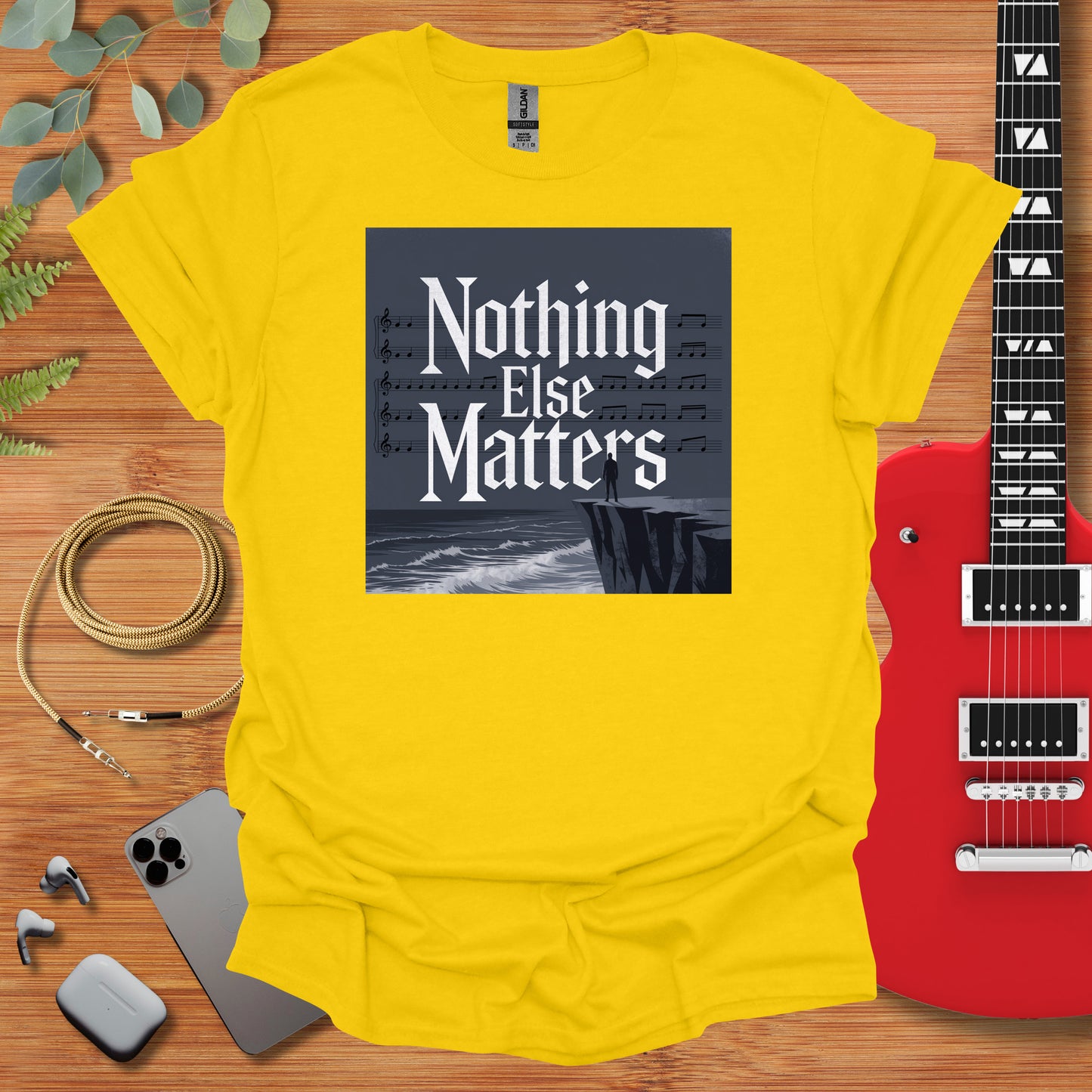 a yellow t - shirt with the words nothing else matters on it