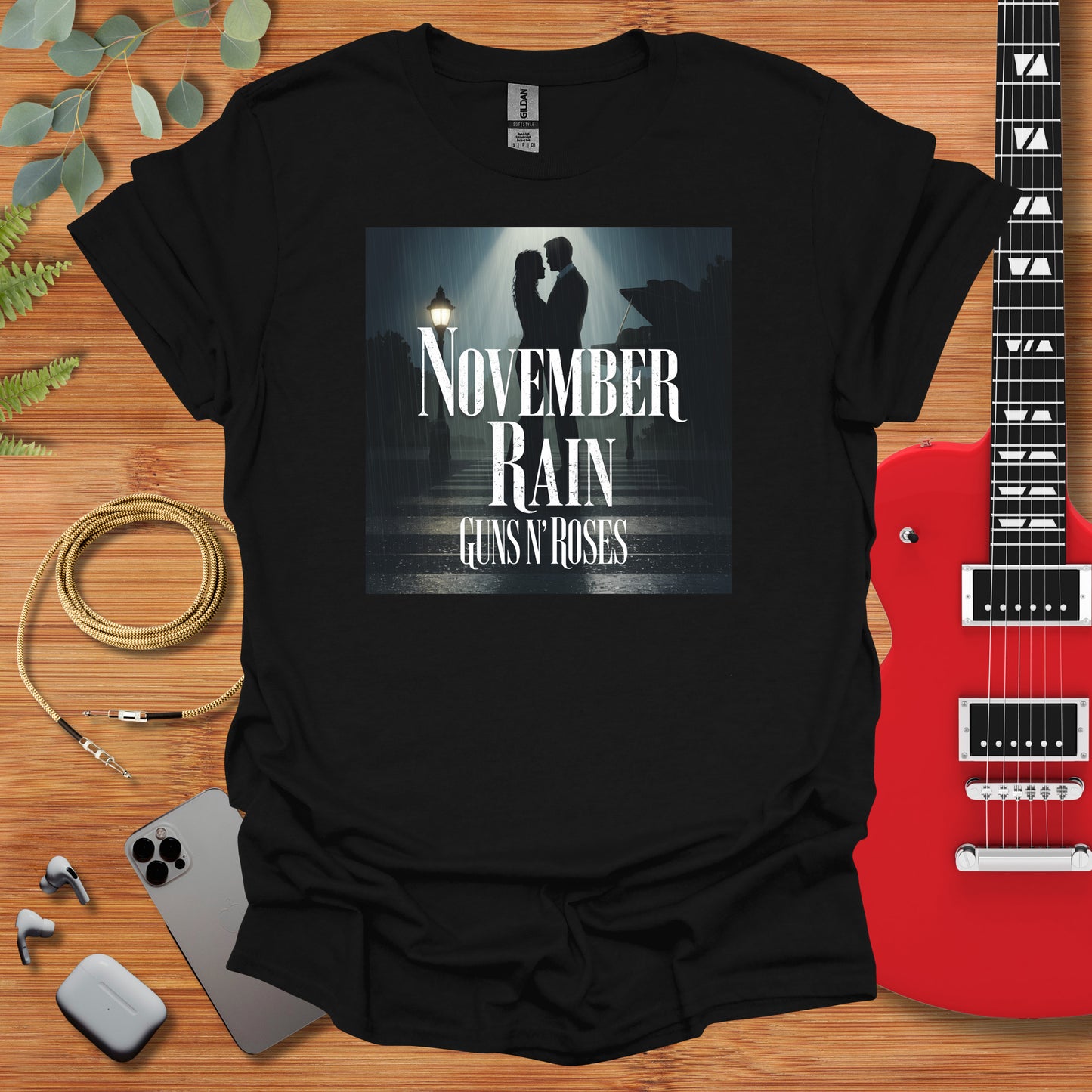 a t - shirt with the words november rain and a guitar next to it