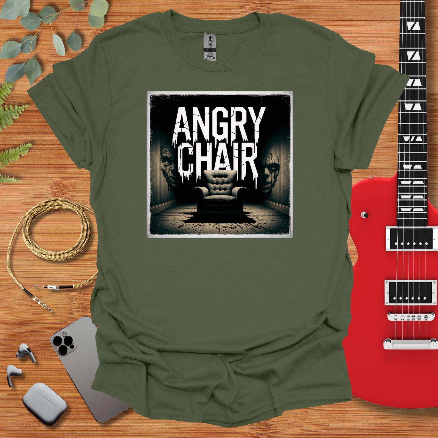 a t - shirt with an image of a chair and a guitar