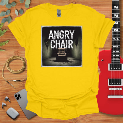 a yellow shirt with an image of a chair and a guitar