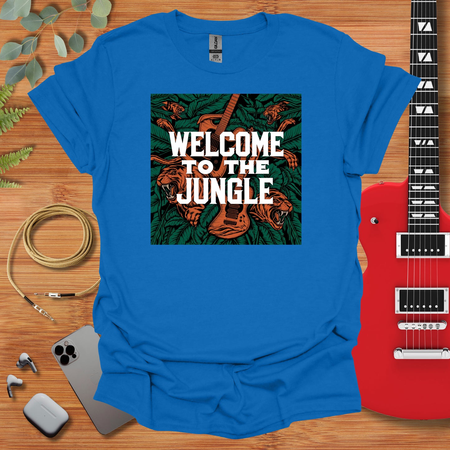 a blue t - shirt with the words welcome to the jungle on it