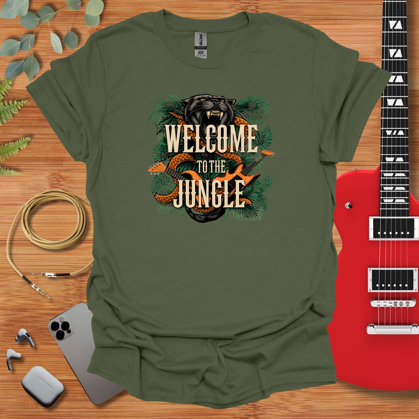 a green t - shirt that says welcome to the jungle