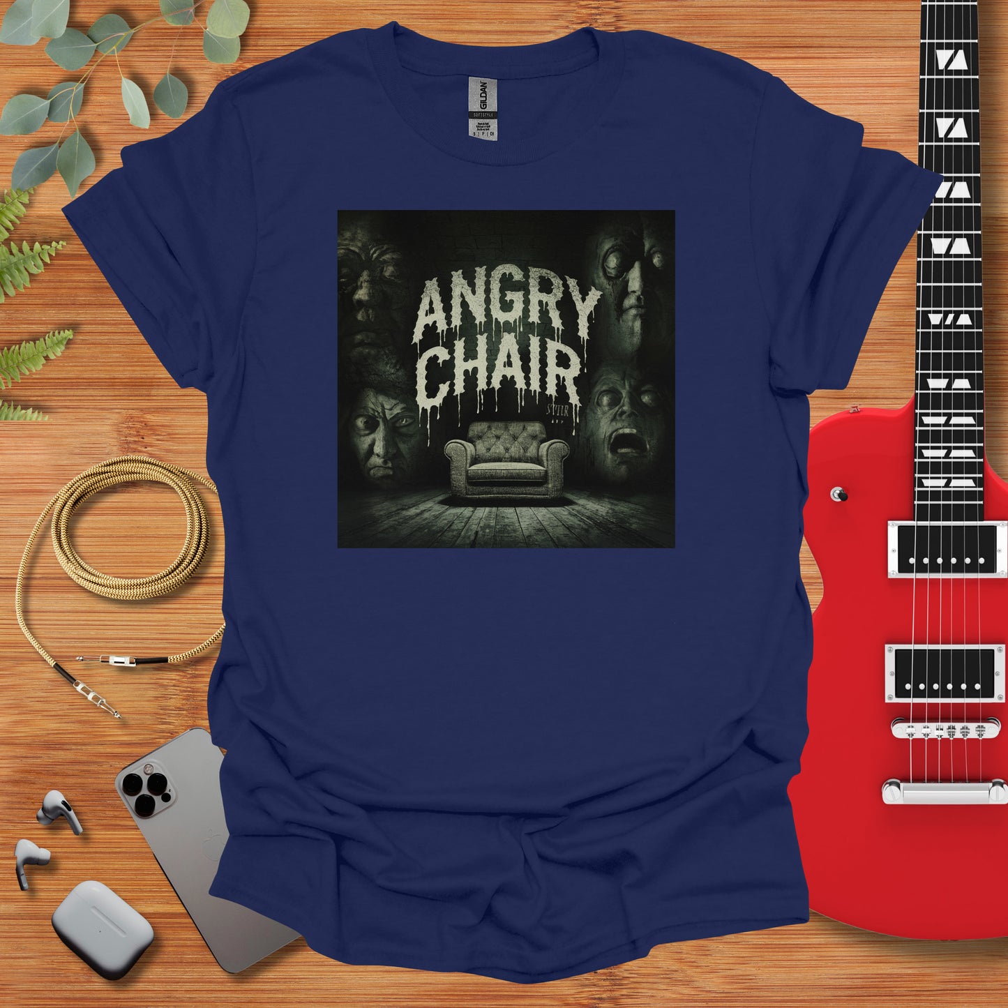 a t - shirt with an image of a couch and a guitar