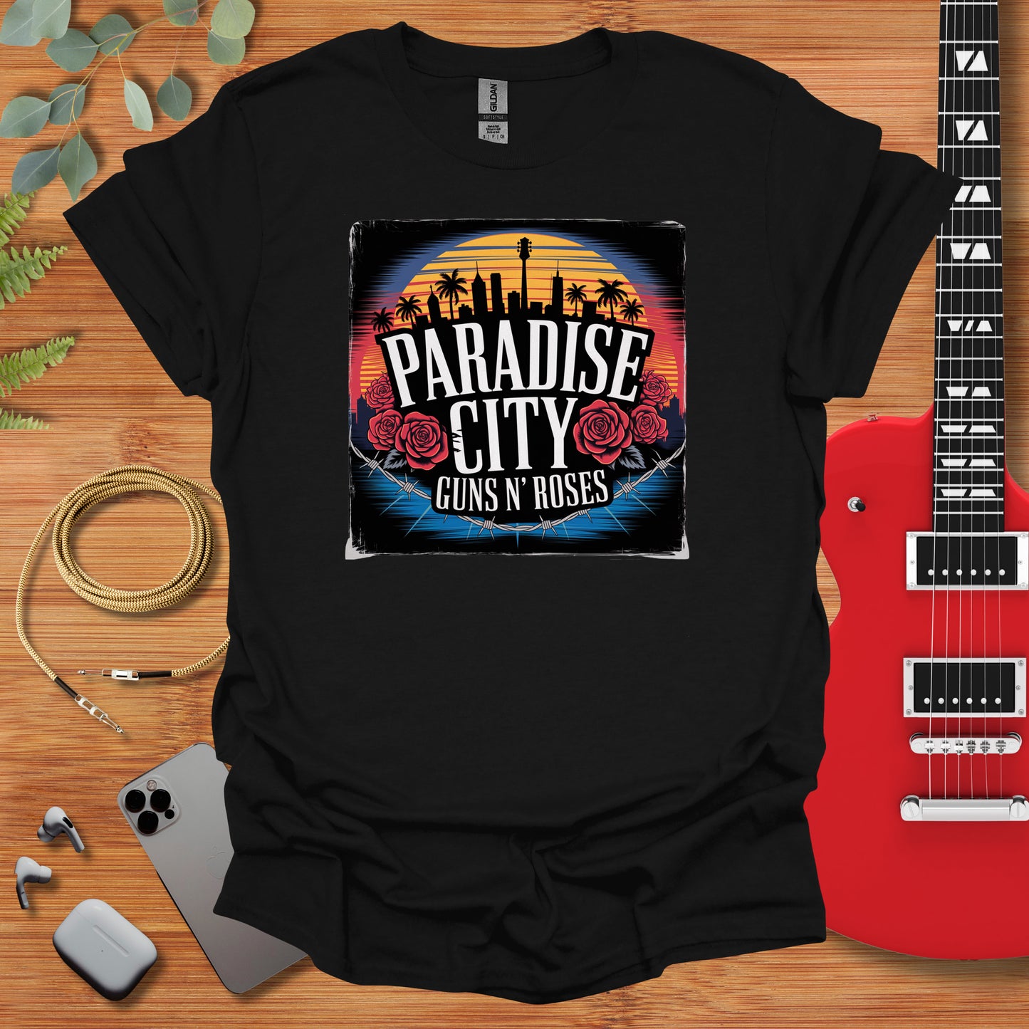 a black t - shirt with the phrase paradise city guns and roses on it