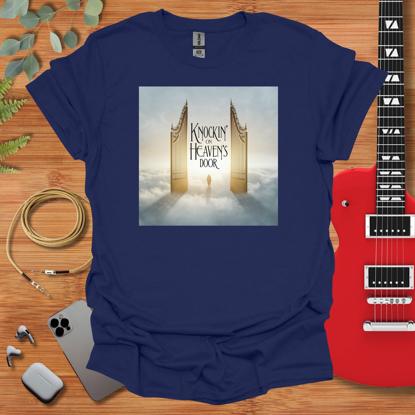 a blue t - shirt with a picture of a golden gate on it