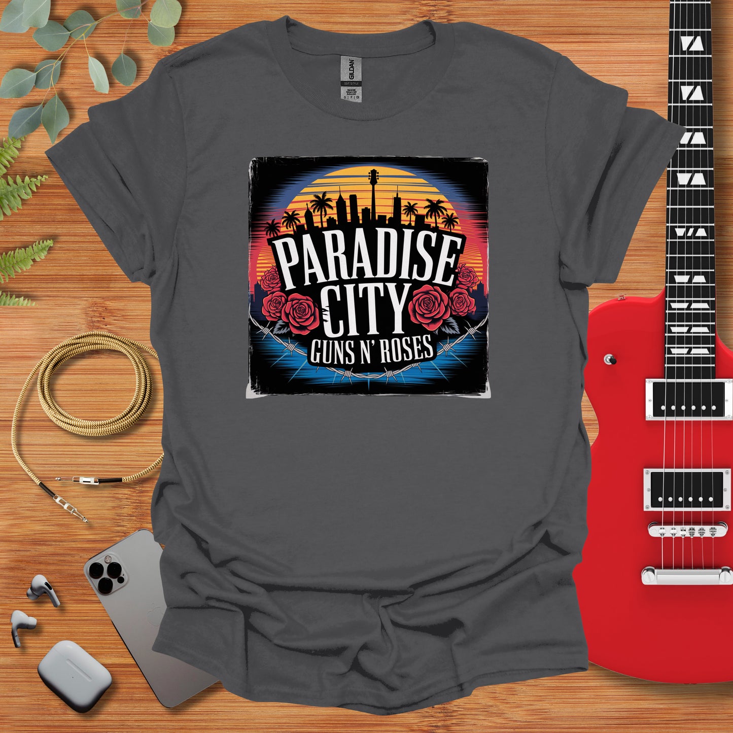 a t - shirt with the phrase paradise city guns and roses on it