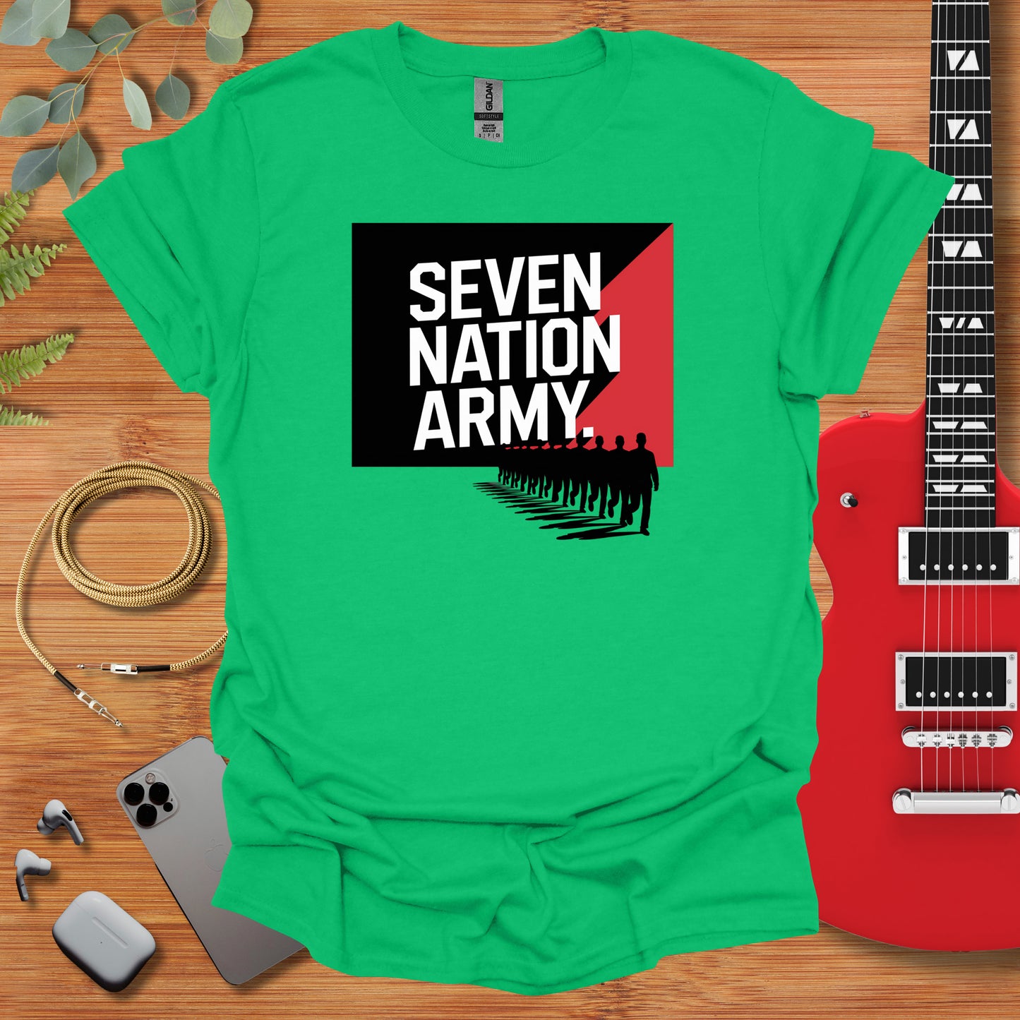 a green shirt with the words seven nation army on it