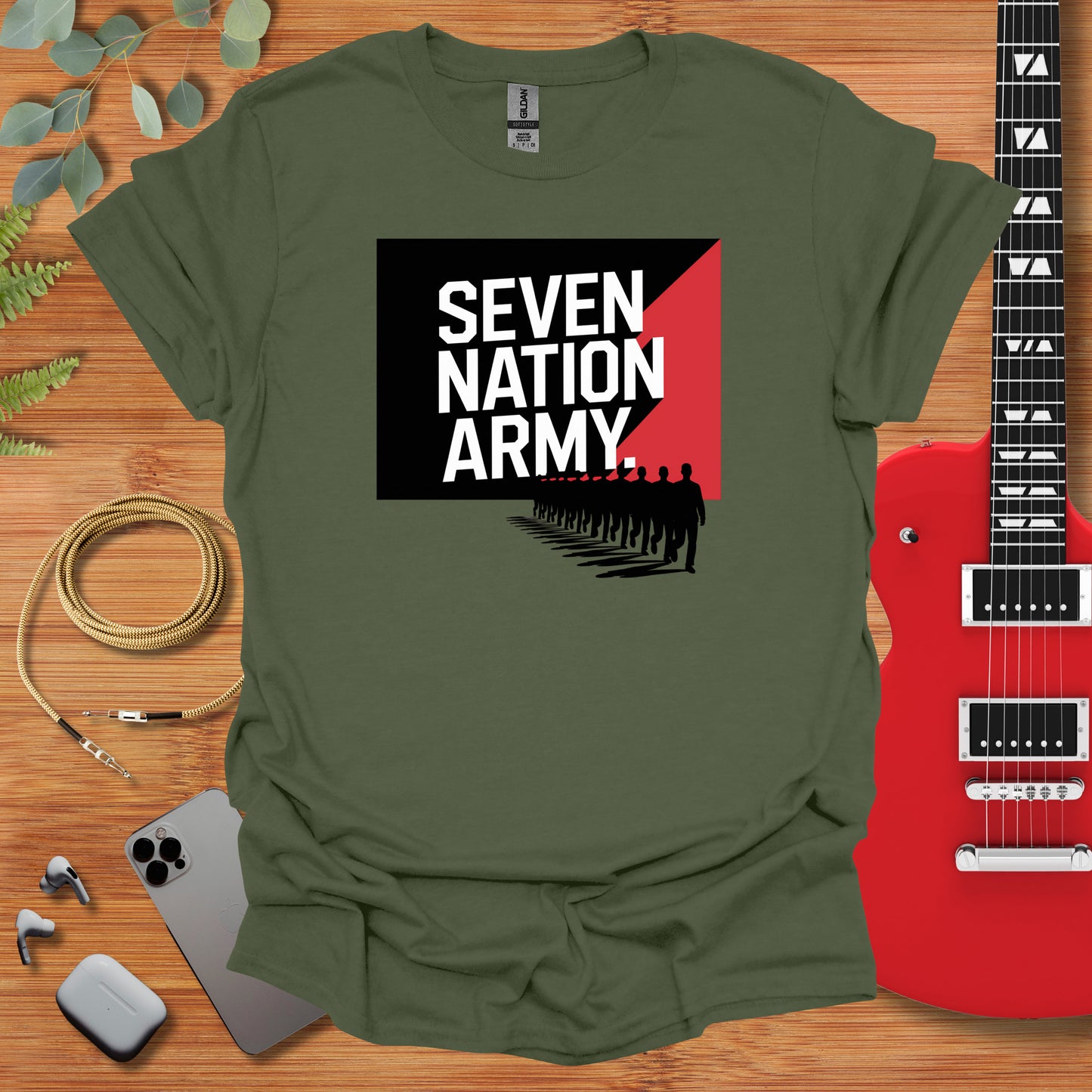 a green t - shirt with the words seven nation army on it