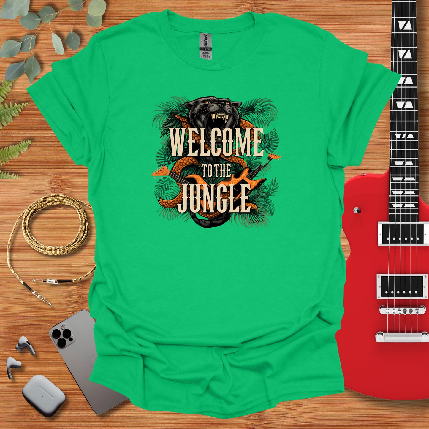 a green shirt with the words welcome to the jungle on it