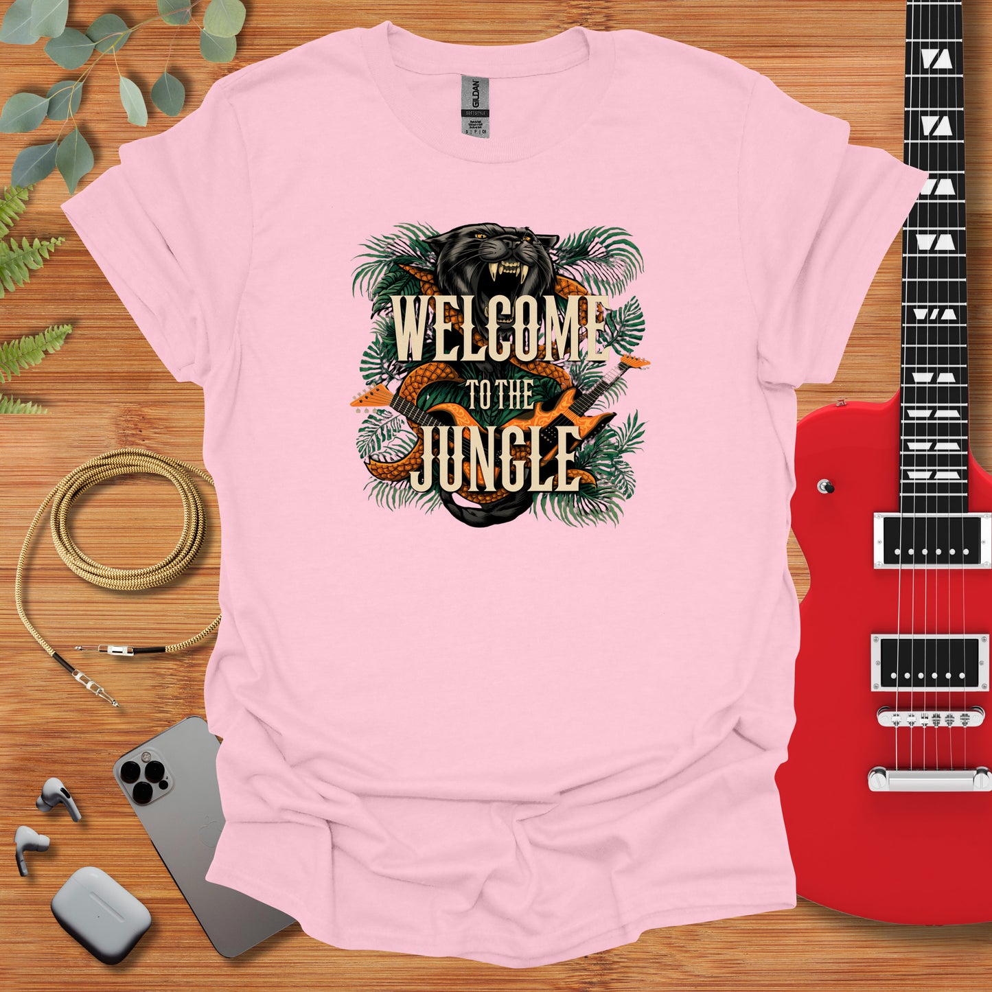 a pink t - shirt with the words welcome to the jungle on it