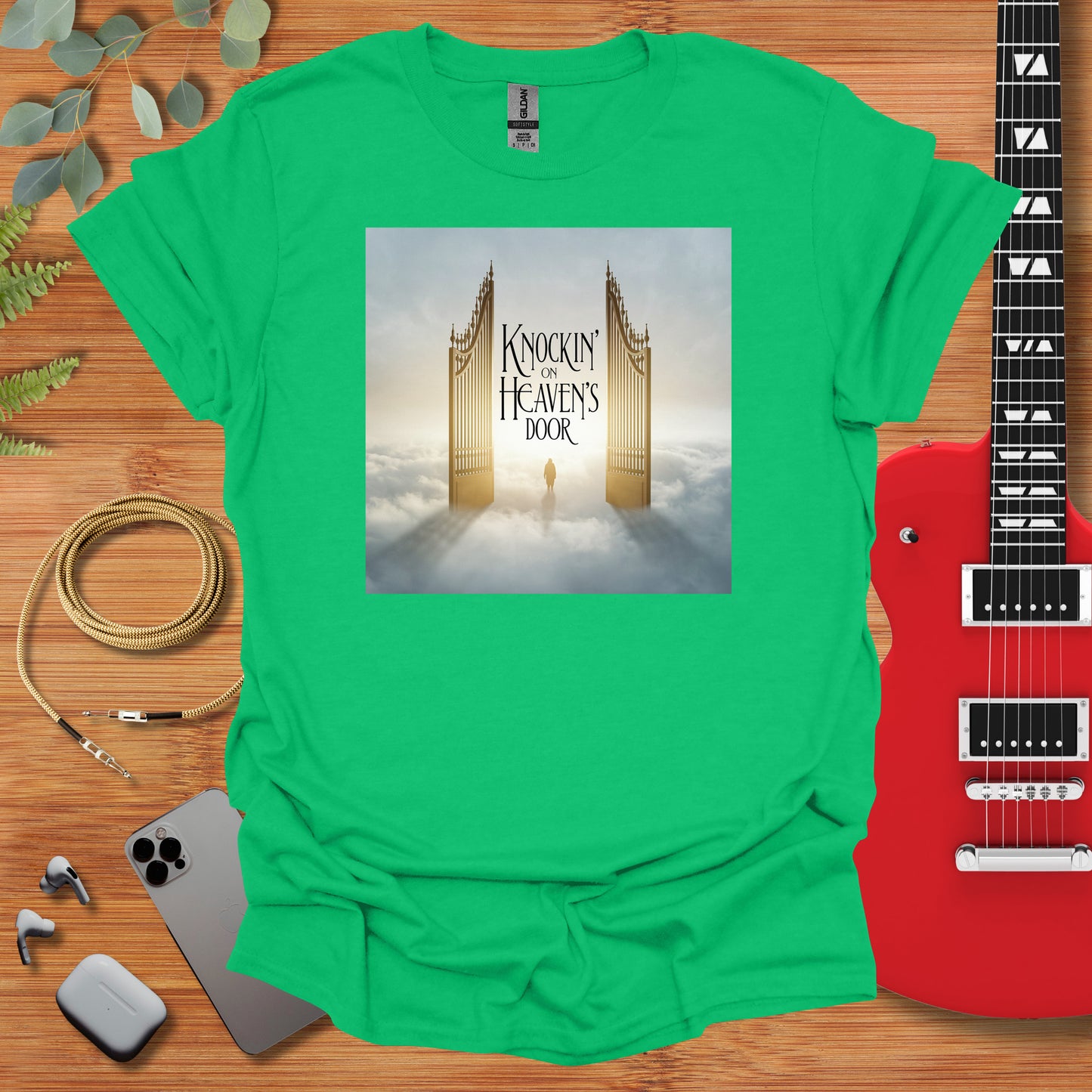 a green t - shirt with a picture of a golden gate on it