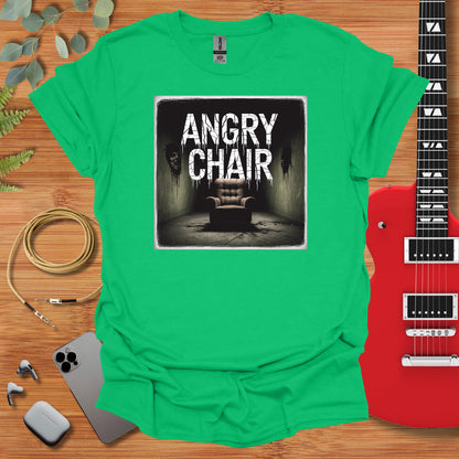 a green shirt with an image of a chair and a guitar