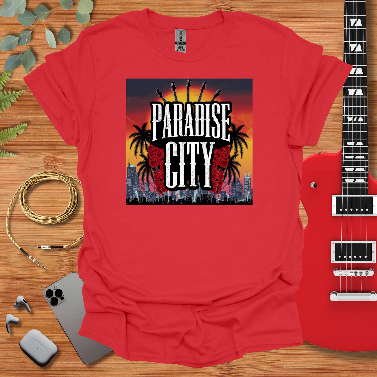 a red shirt with the words paradise city on it