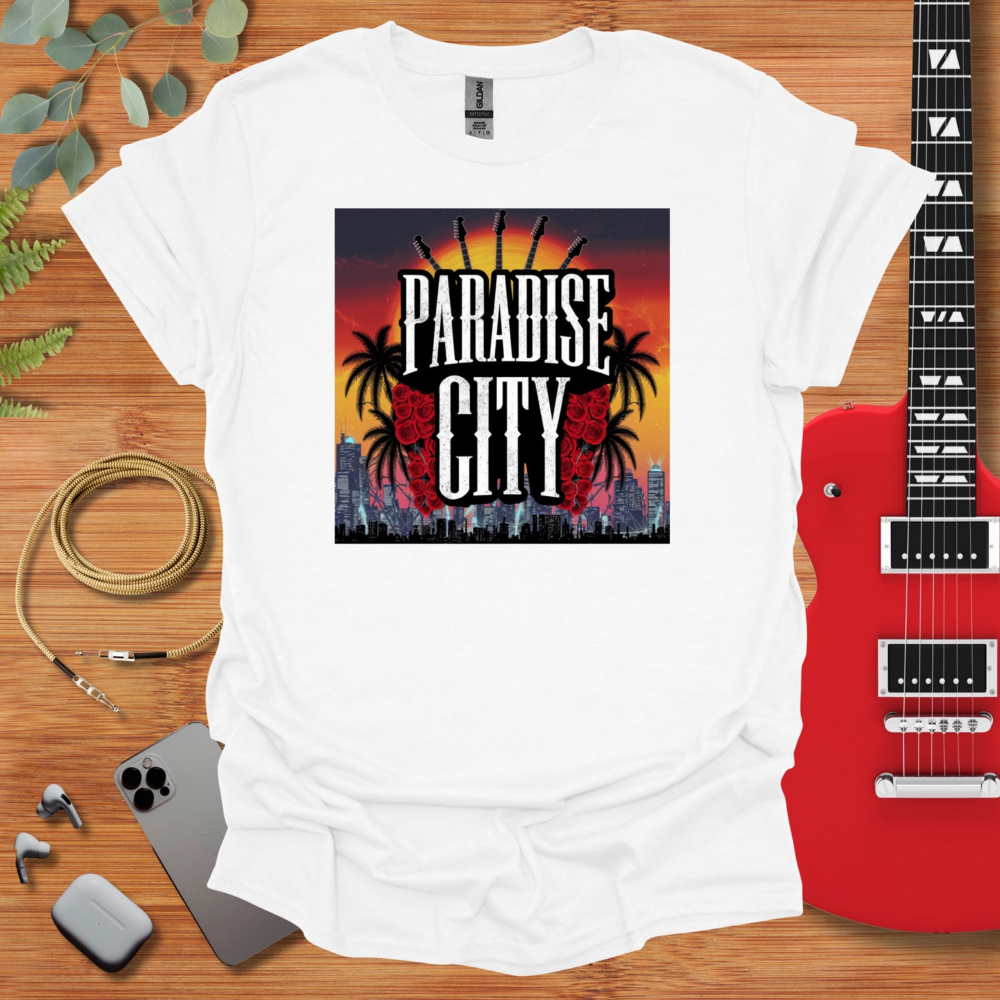 a white t - shirt with the words paradise city on it