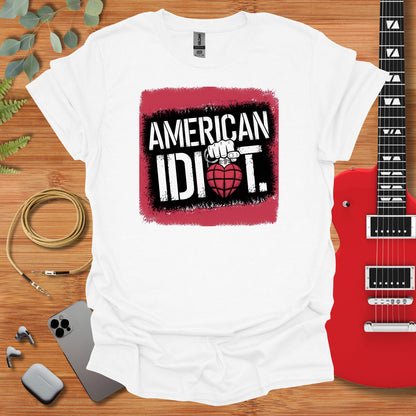 a t - shirt that says american idiot with a guitar next to it