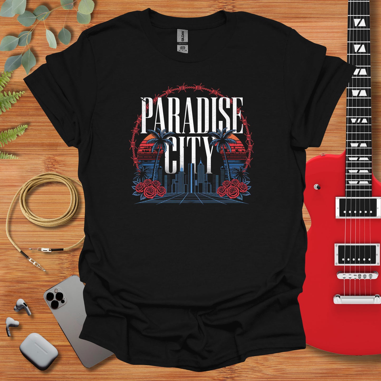 a black t - shirt with the phrase paradise city on it