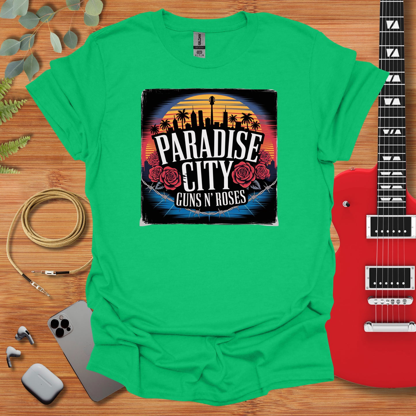 a green shirt with the phrase paradise city guns and roses on it