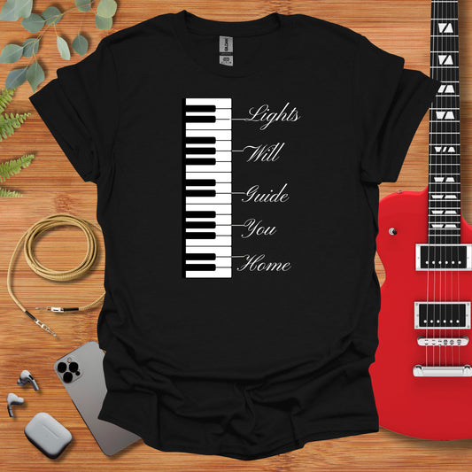 a black t - shirt with a piano keyboard on it