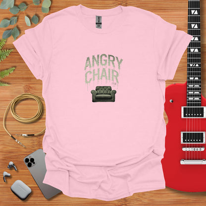 a pink t - shirt with an image of a chair and a guitar